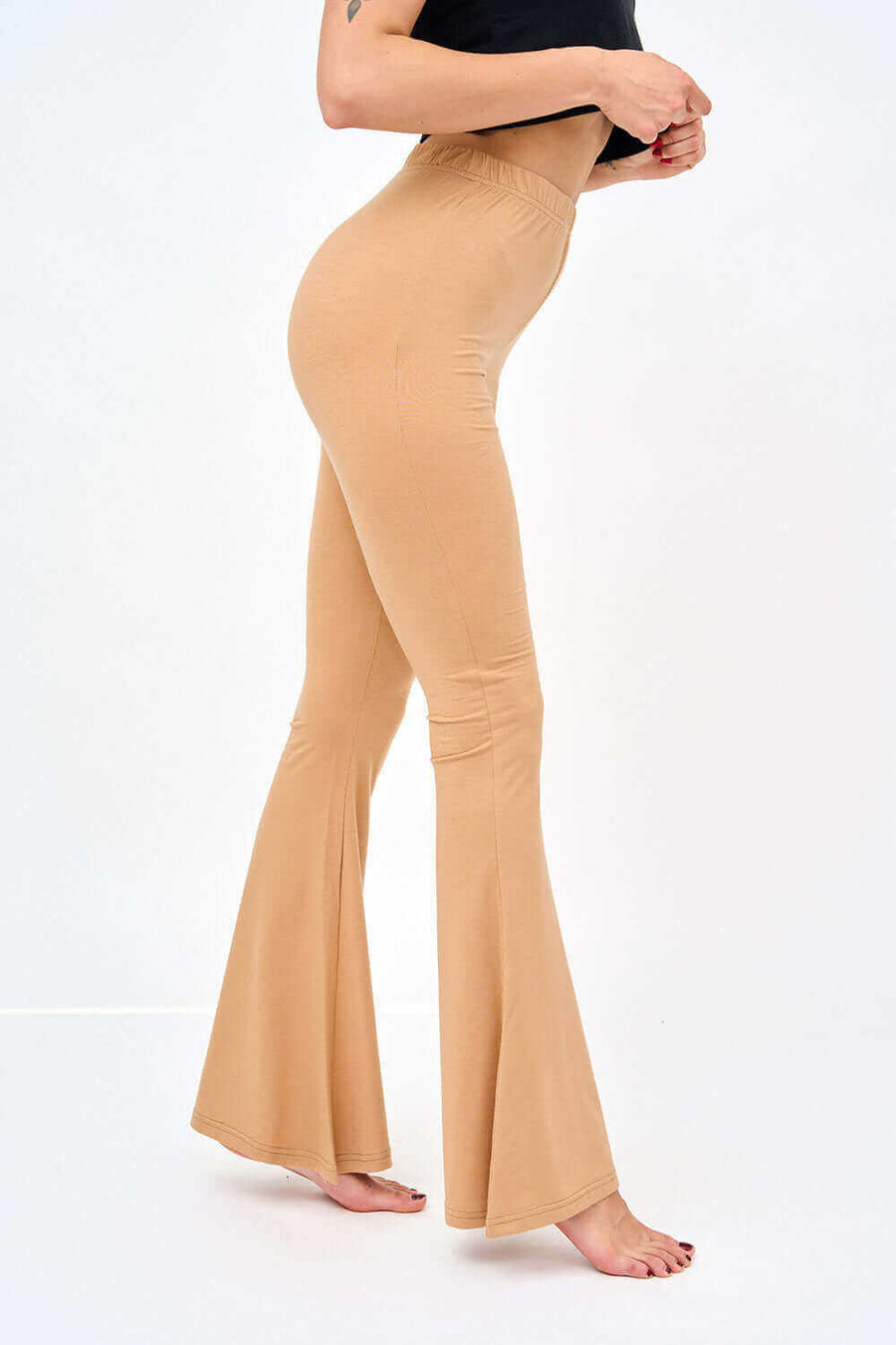 Right Side View of Womens Bell Bottom Leggings in Solid Skin