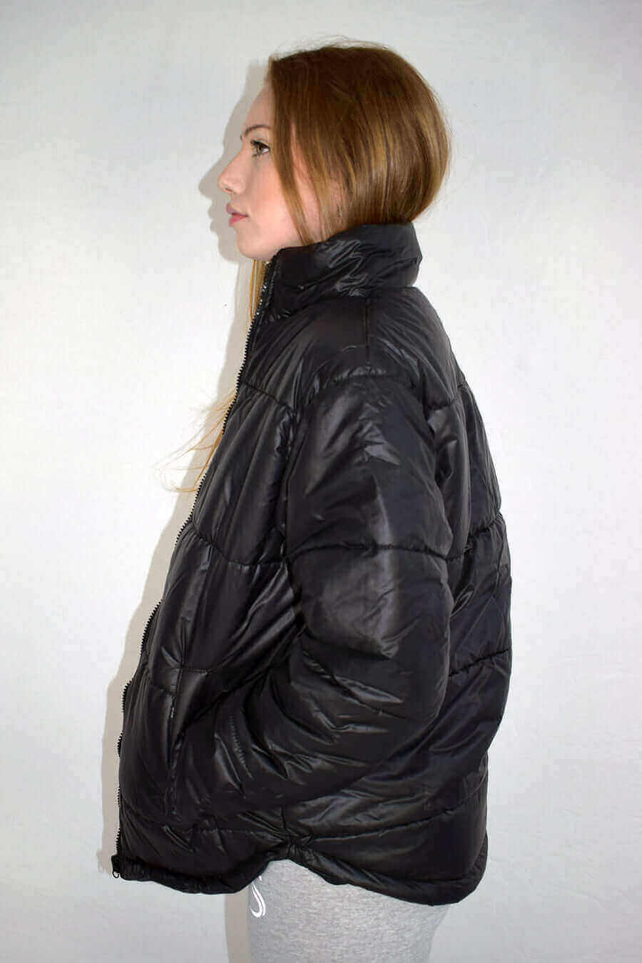 Left Side Pose of Zipped Black Puffer Jacket for Womens