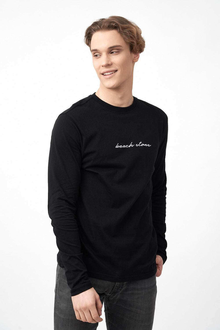 Side Pose of Long Sleeve Men's Shirts in Black with Embroidered Logo